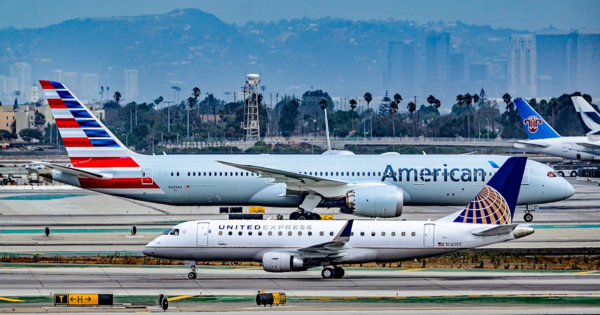 A Skywest Airlines Embraer 175 (foreground) and an American Airlines Boeing 787-9 cross paths at Los Angeles International Airport. (Photo: Flickr: <a href="http://creativecommons.org/licenses/by-sa/2.0/" target="_blank">Creative Commons (BY-SA)</a> by <a href="http://flickr.com/people/tomasdelcoro" target="_blank">TDelCoro</a>)