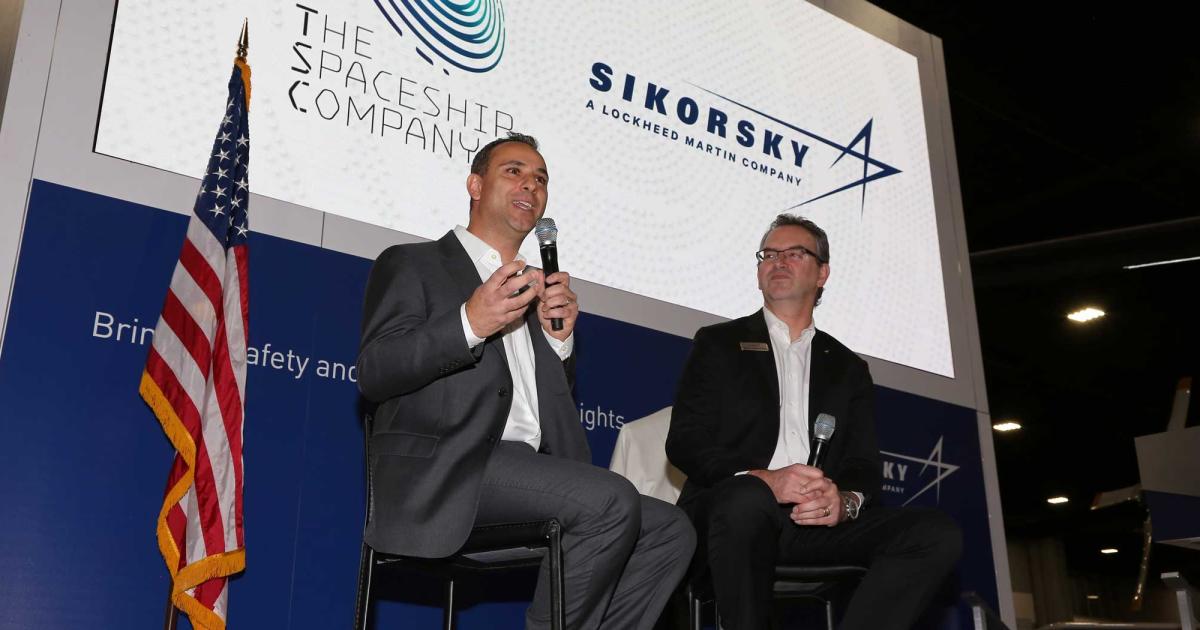 Enrico Palermo (l), president of The Spaceship Company, outlines potential future urban mobility operations with Sikorsky Innovations v-p Chris Van Buiten.
