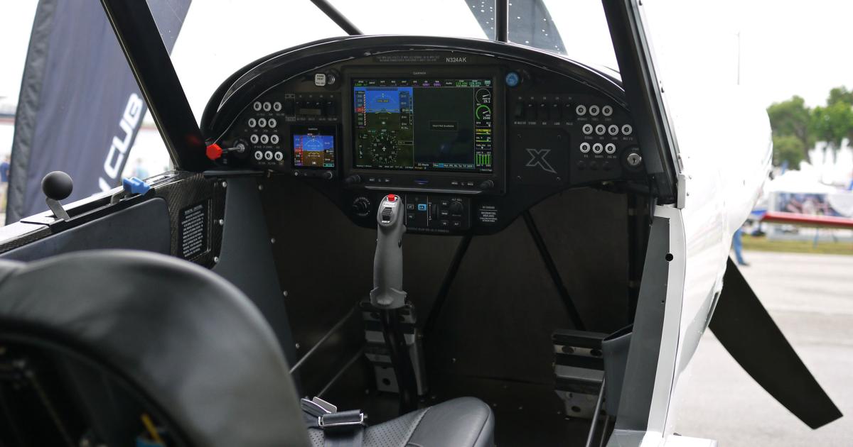 The modern flight deck of the Cubcrafters X Cub holds a Garmin 3X Touch.