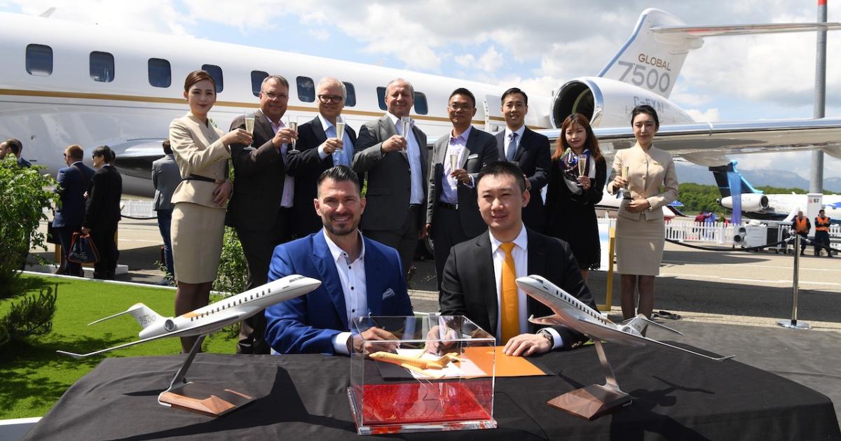 Bombardier Aviation president David Coleal (left) and HK Bellawings president YJ Zhang sign a firmed order for two and options for another five Global 7500s. (Photo: Bombardier)