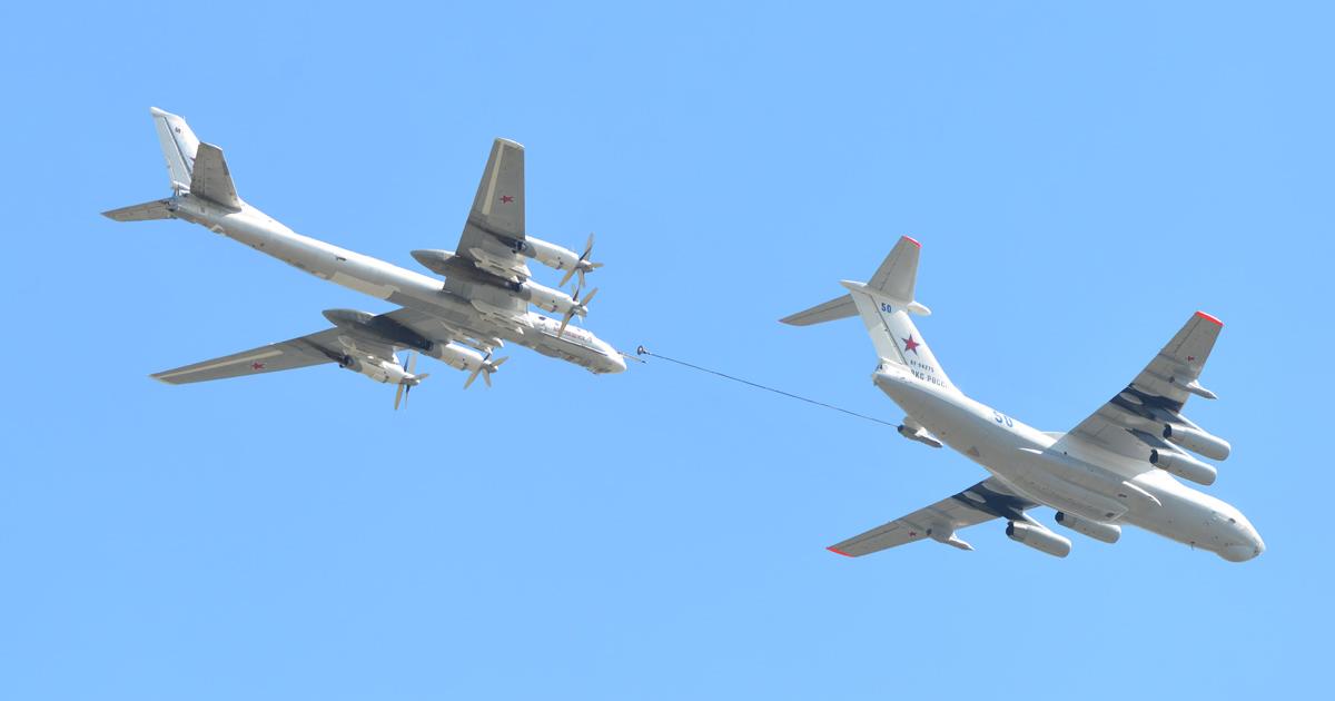 A Tu-95MSM flies closely behind an Il-78M tanker during a rehearsal for the canceled 2019 Victory Day flypast. The upgraded "Bear-H" displays its newly acquired outboard underwing pylons. (Photo: Vladimir Karnozov)