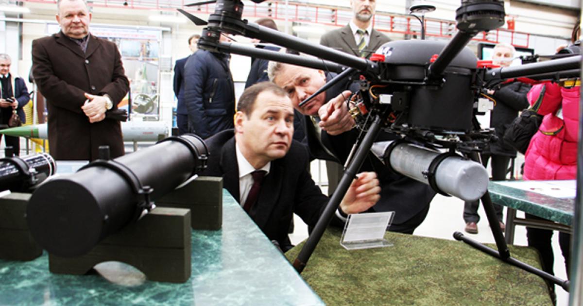 Belarus officials inspect the Grach UAS, which can carry light weapons. (Photo: Milex/Belexpo)