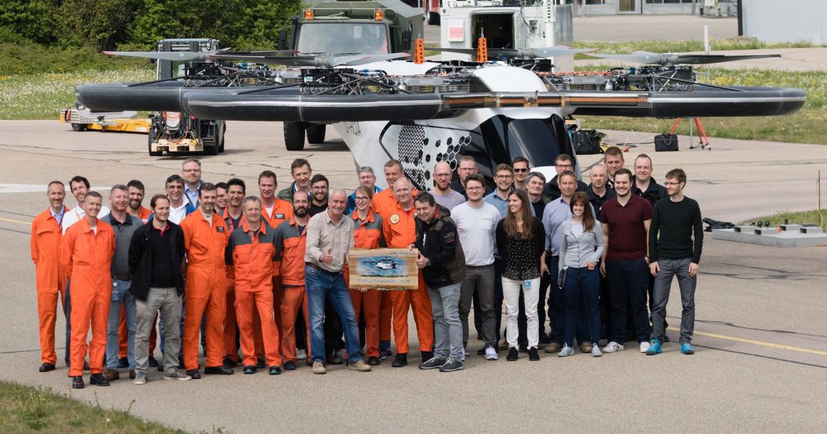 The flight demonstration team poses with the CityAirbus eVTOL air mobility vehicle.