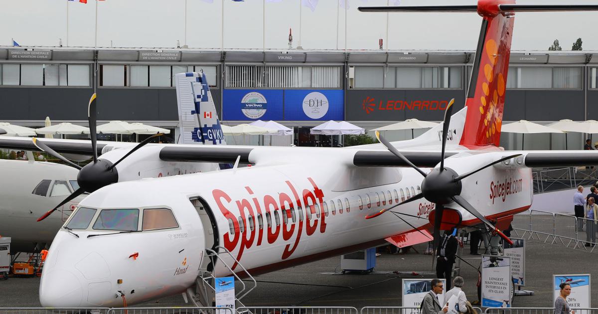 A Bombardier Q400, doing marketing duty as a Dash 8-400 for De Havilland of Canada, graces the Paris Air Show static display in the colors of India's SpiceJet. (Photo: David McIntosh)