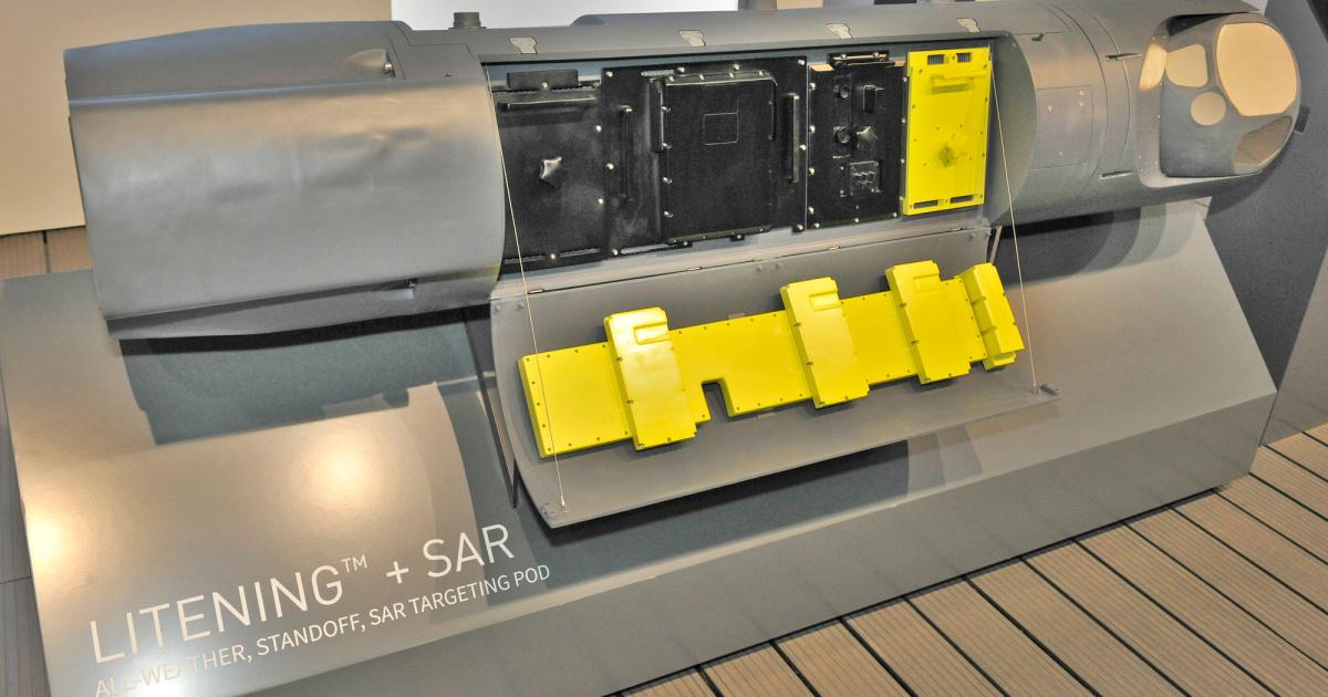 Rafael’s Litening and RecceLite targeting and reconnaissance pods have a free slot in their electronics bay for additional systems, here filled by an Elta synthetic aperture radar (in yellow), with the associated antenna mounted on the inside of the bay door, also in yellow. (Photo Mark Wagner)