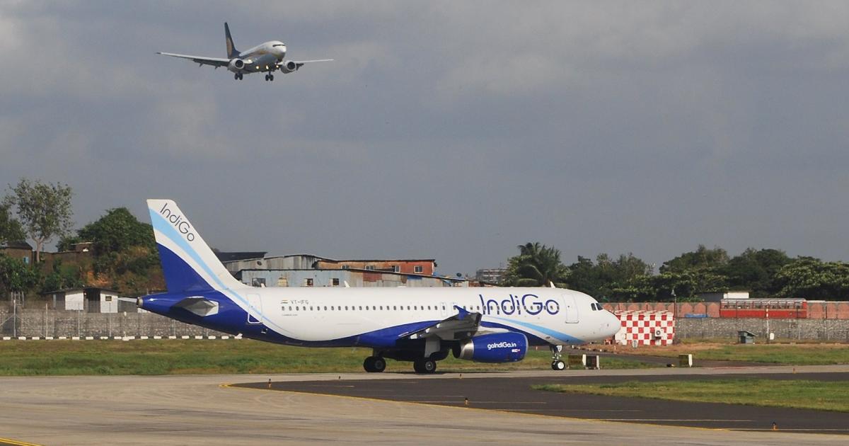An IndiGo Airbus A320 taxis as a Jet Airways Boeing 737-800 approaches Chhatrapati Shivaji International Airport in western India. (Photo: Flickr: <a href="http://creativecommons.org/licenses/by-sa/2.0/" target="_blank">Creative Commons (BY-SA)</a> by <a href="http://flickr.com/people/kurushpawar" target="_blank">Kurush Pawar - DXB</a>)