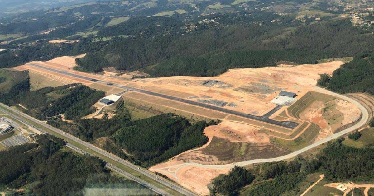 The 8,104 foot runway at Catarina Executive Airport in São Paulo is paved, with the FBO at its midpoint and the first hangar near the head.