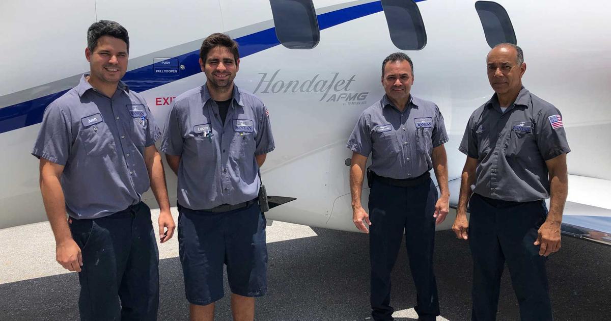 Members of Banyan Air Service's MRO crew pose by the HondaJet which they recently upgraded with the manufacturer's Advanced Performance Modification Group package. Among the benefits: shortened takeoff distance, and increased MTOW.