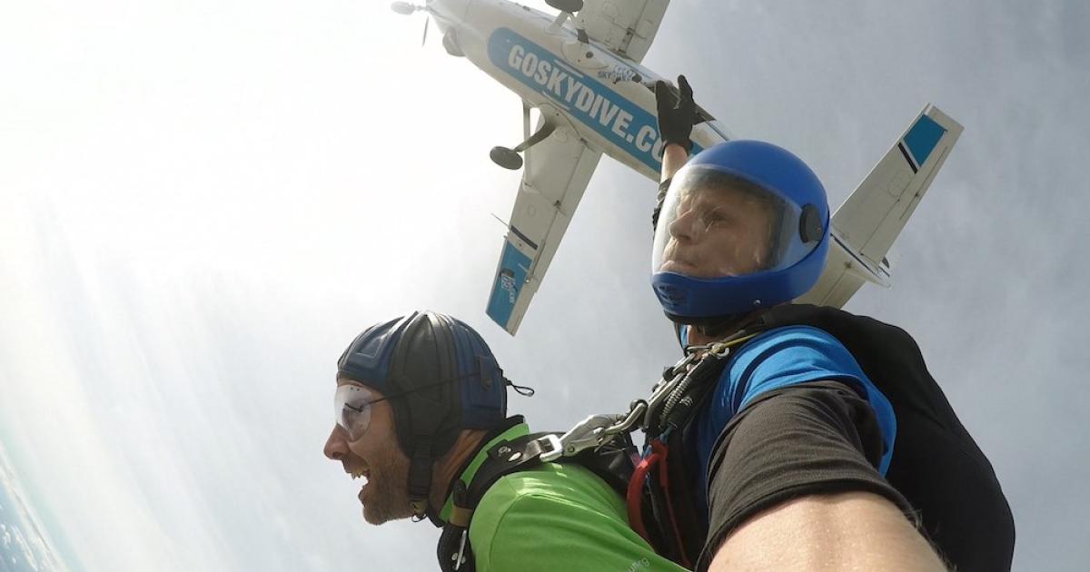 ACS public relations manager Glenn Phillips (left, with instructor) was among those braving a tandem skydive at Old Sarum.
