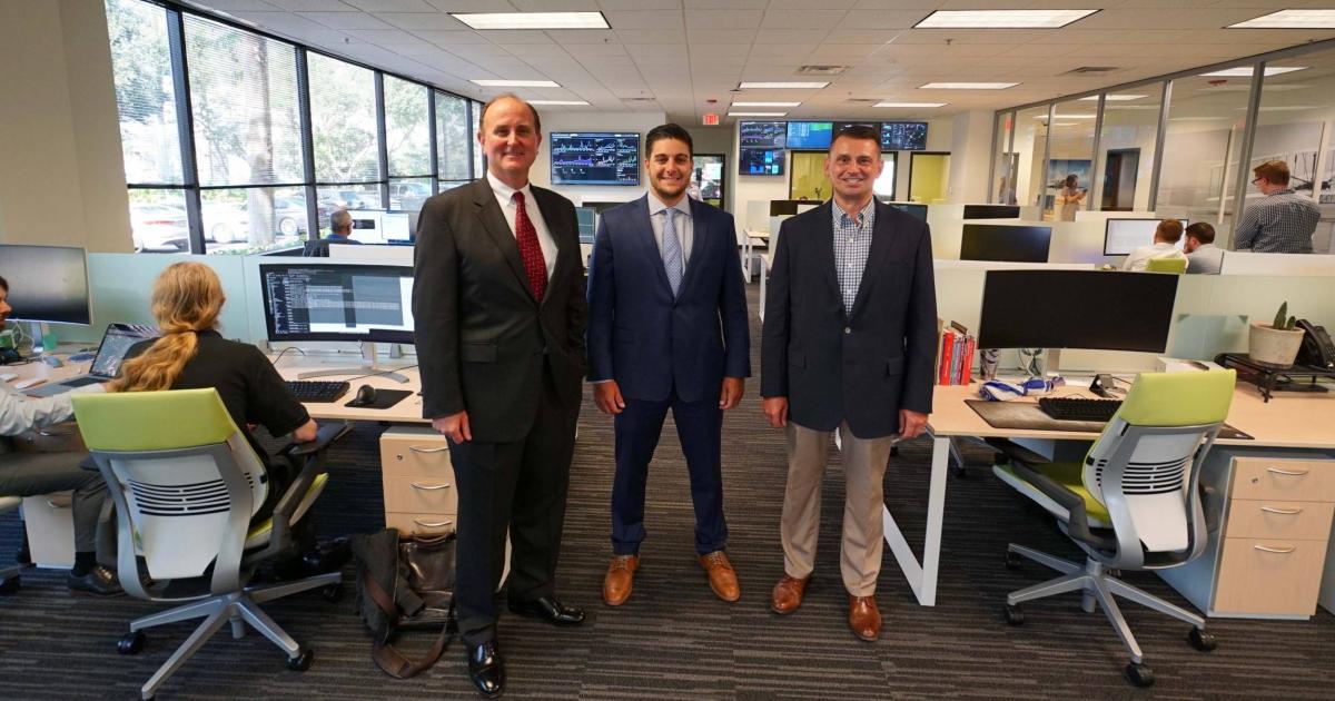 Flightdocs CEO Rick Heine, left, with president Greg Heine and Bonita Springs (Florida) Mayor Peter Simmons at the grand opening of the company's technology center in August 2018. (Photo: Flightdocs)