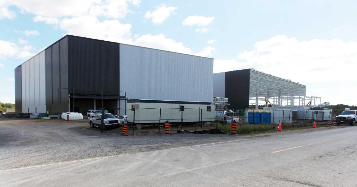 To support the thriving business at its headquarters in Peterborough, Canada, Flying Colours is constructing a 100,000 sq ft addition. Due in October is a 50,000 sq ft paint shop capable of handling bizliner-size aircraft such as the Boeing 737/BBJ (l.). A 50,000 sq ft completions hangar will come online in the first quarter of 2020, providing enough space for four large-cabin business jets. (Photo: Curt Epstein)
