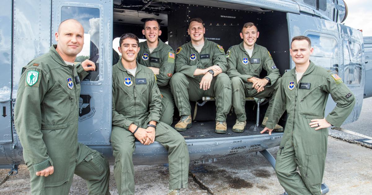 (From left to right) U.S. Air Force students 2nd Lt. Trent Badger, 2nd Lt. J. Karl Bossard, 1st Lt. Matthew Gulotta, 2nd Lt. John Thrash, Capt. Josh Park, and 2nd Lt. Richard Songster with a TH-1H helicopter at Fort Rucker, Ala., Oct. 10, 2019. All six officers graduated from Specialized Undergraduate Pilot Training-Helicopter Class 20-02, which incorporated virtual reality in an experimental curriculum that resulted in the class graduating six weeks earlier than normal training classes while reducing actual flying time in the TH-1H by about 35 percent. (Photo: U.S. Air Force/Brian Braden)