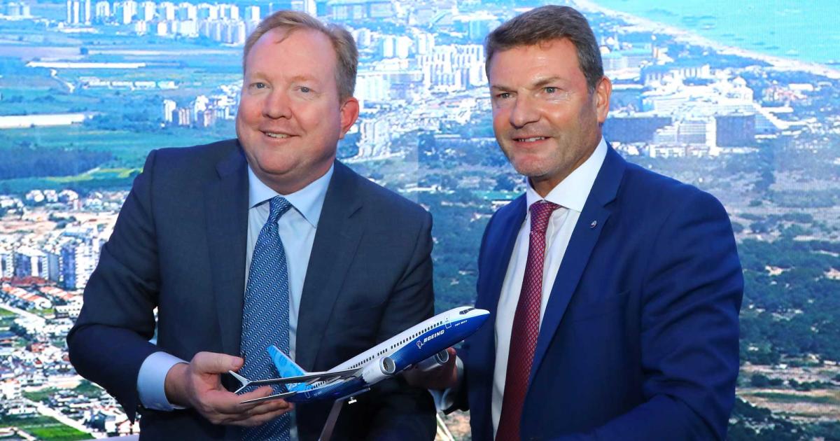 Boeing Commercial Airplanes CEO Stan Deal (left) and SunExpress CEO Jens Bischof celebrate an order for ten 737 Max 8s at the 2019 Dubai Airshow.