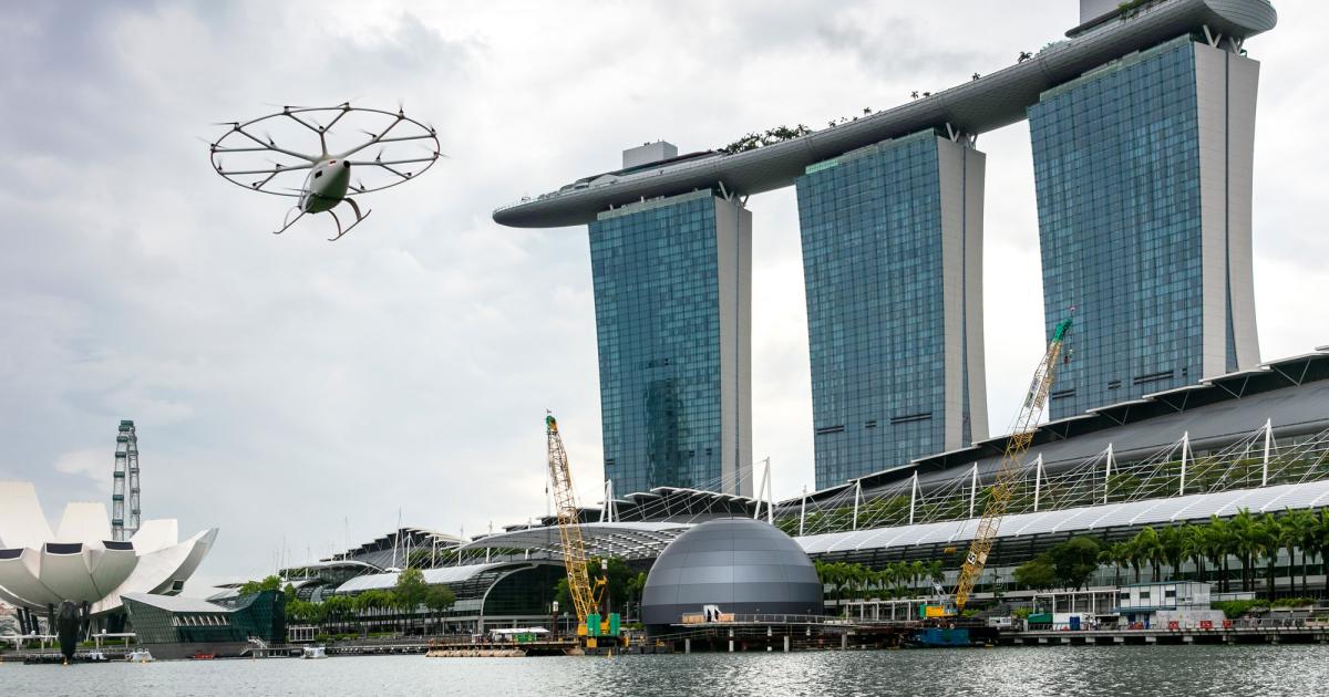Volocopter recently conducted flight tests of its urban air mobility vehicle in Singapore and unveiled its concept for the VoloPort ground facility. 