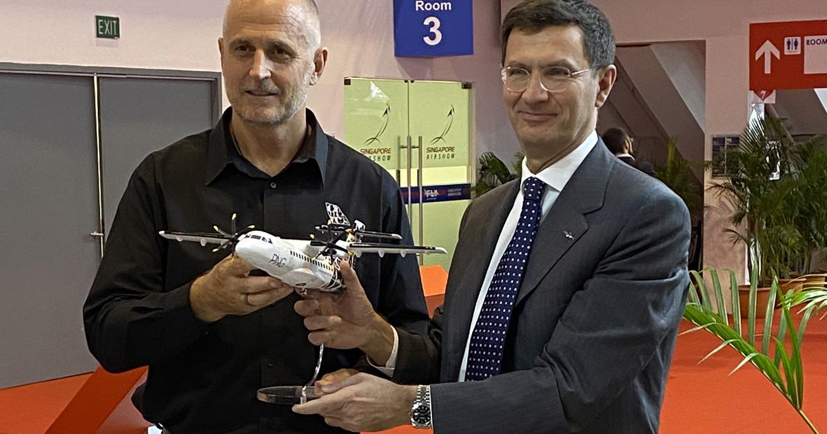 The CEOs of PNG Air (Paul Abbot, left) and ATR (Stefano Bortoli, right) celebrate the deal to acquire three ATR42-600S turboprops. (Photo: David Donald)