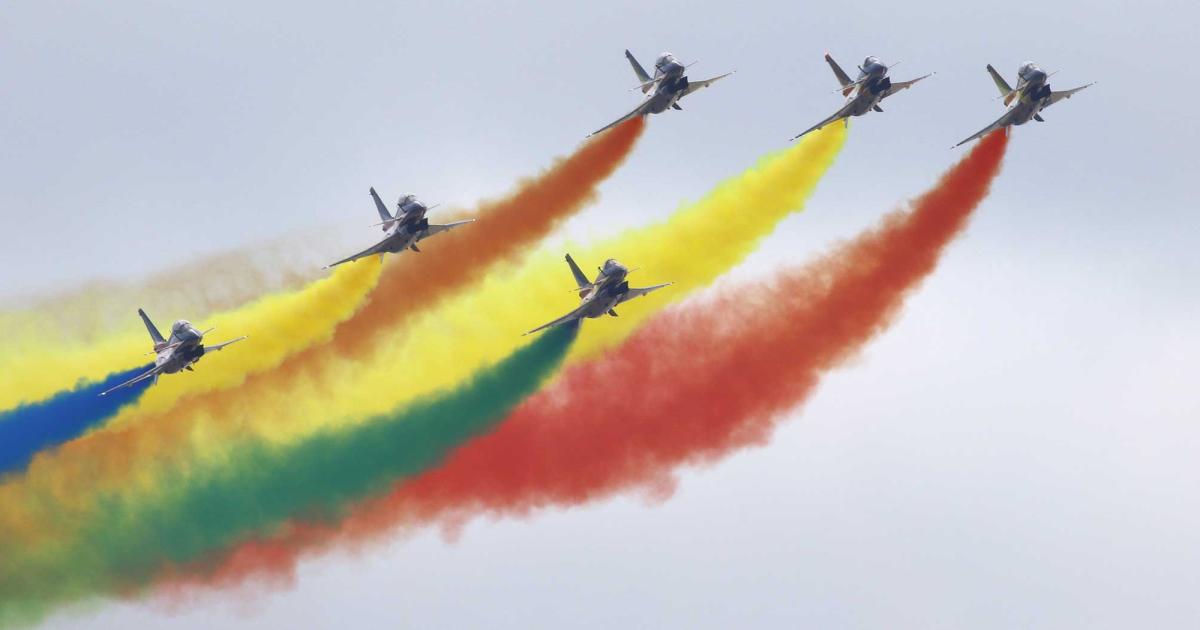 Although the China delegation was not able to attend the Singapore Airshow, the People’s Liberation Army Air Force Ba Yi (August 1st) team worked closely with authorities to ensure no health risks during their visit to perform colorful aerobatics in these J10 fighters. (Photo: David McIntosh/AIN)