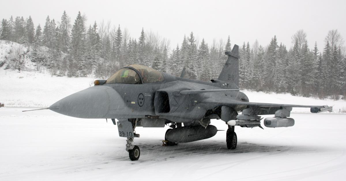Gripen E 39-10 is seen in typical Finnish winter weather at Tampere-Pirkkala. The aircraft is outfitted with Iris-T and Meteor air-to-air missiles, and the Electronic Attack Jammer Pod. (photo: David Donald)