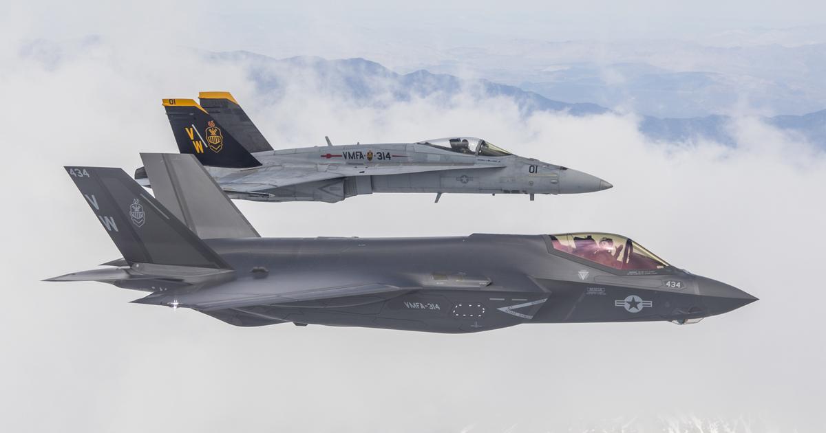 VMFA-314’s first F-35C flies from Lemoore in June in company with one of the squadron’s outgoing F/A-18A++ aircraft, the latter flown by squadron commander Lieutenant Colonel Cedar Hinton. (Photo: U.S. Navy)