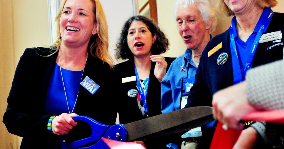 Allison McKay (left), recently stepping into the role of CEO of WAI, kicks off the organization's 2020 conference with a ribbon-cutting ceremony along with (from center left) Deborah Hecker, WAI board member and American Airlines' chief pilot in Dallas; Wally Funk, retired NTSB; and Rhonda Larance, WAI board member and industry relations manager for Boeing unit Jeppesen. (Photo: Mike Ullery for WAI).
