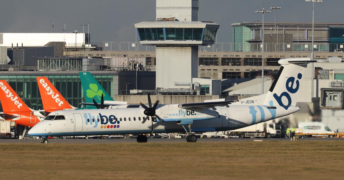 A Flybe De Havilland Dash 8-400s taxis at Manchester Airport in the UK. (Photo: Barry Ambrose)