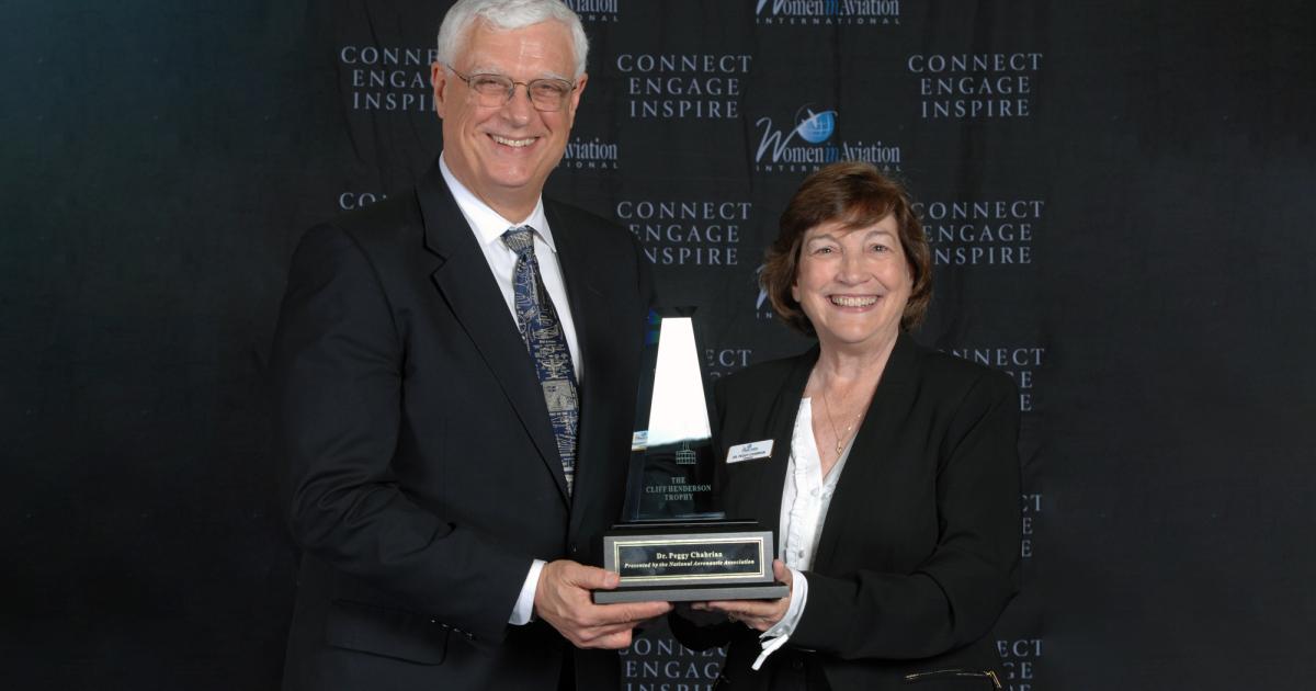 NAA's Greg Principato awards the 2020 Cliff Henderson Trophy to Dr. Peggy Chabrian (right). (Photo: WIA)