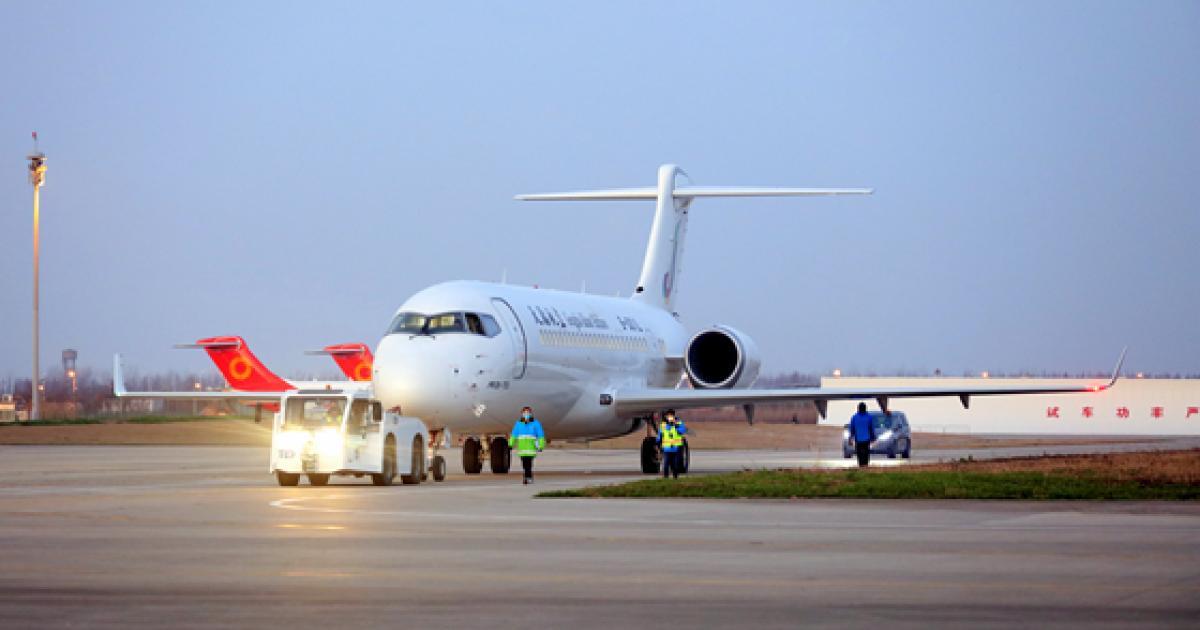 ARJ21 aircraft 132 gets towed into position at Shanghai Pudong International Airport. (Photo: Comac)