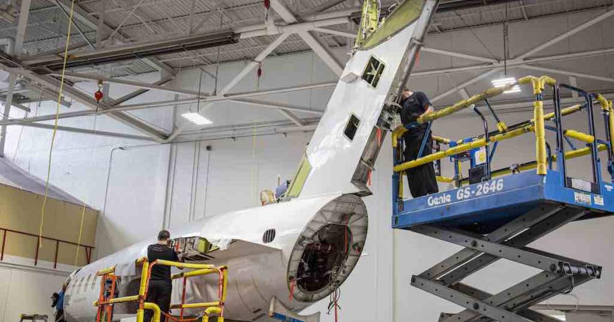 Technicians at Constant Aviation perform a 7,500-cycle inspection on a Bombardier Challenger 300-series twinjet. (Photo: Constant Aviation)