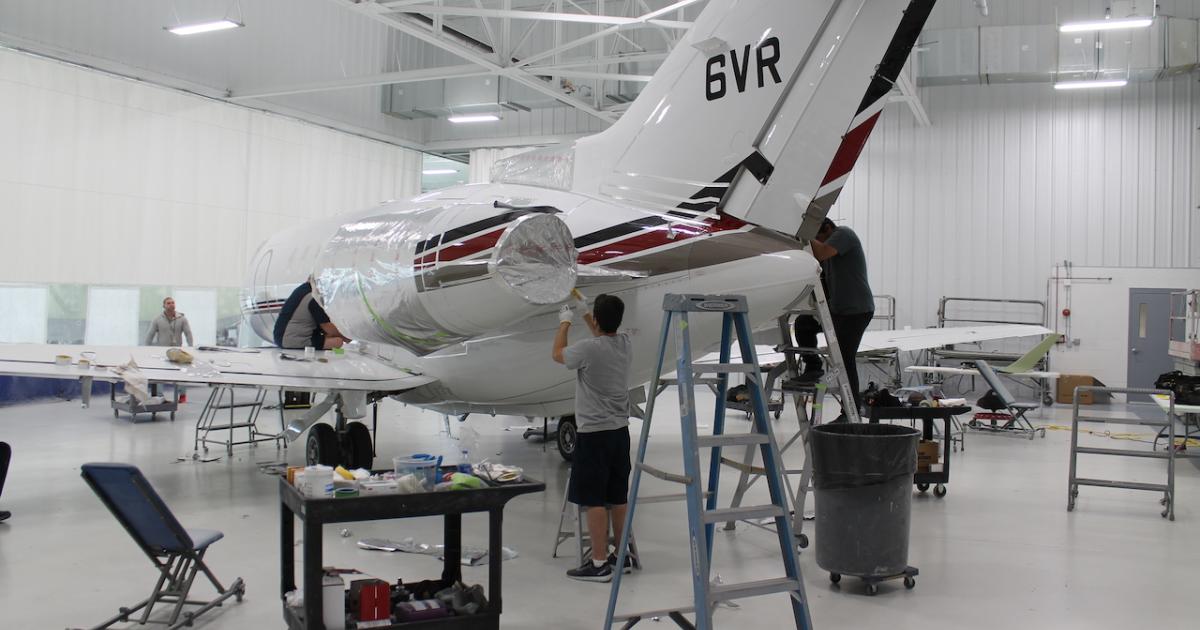 Yingling Aviation crews prepare a Hawker 800XP for paint at its new paint operation. (Photo: AIN/Jerry Siebenmark)