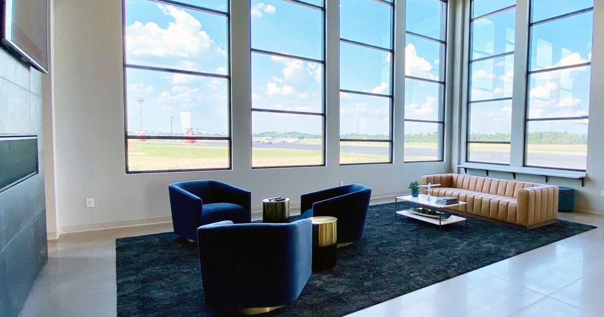 The passenger lobby at the new Aircraft Specialties FBO at Clark Regional Airport in Sellersburg, Indiana bathes guests in natural light as well as providing a panoramic view of the airport and runway.