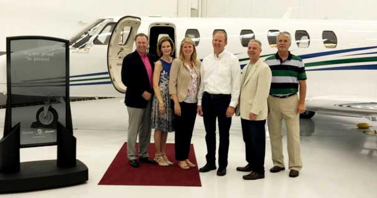 Another Happy Union: Partners in Aviation customers, the proud owners of a new Cessna Citation, pose with PIA president Mark Molloy (second from right) at the delivery ceremony for their CJ3+.