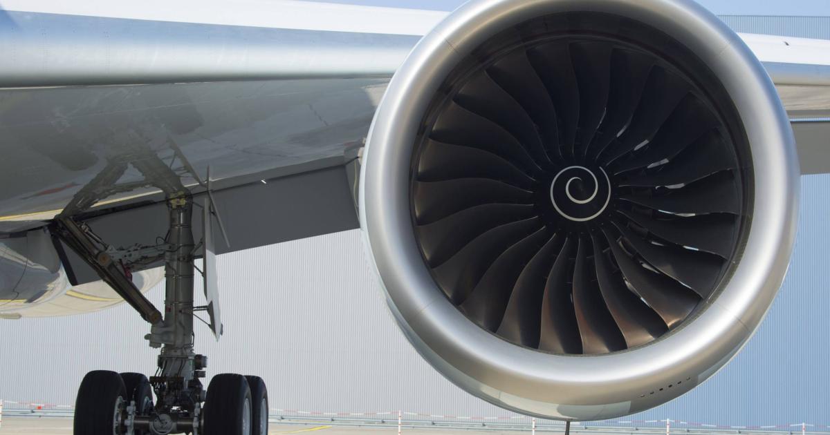 A Rolls-Royce Trent XWB-84 turbofan hangs from the wing of a Cathay Pacific Airbus A350-900. (Photo: Airbus)