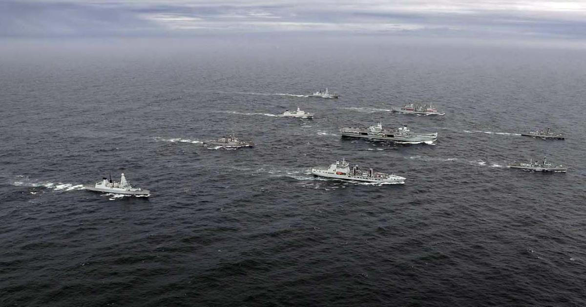 The Carrier Strike Group sails in Scottish waters. The activities of a Dutch frigate and U.S. destroyer are fully integrated with those of six Royal Navy vessels to form a Combined Joint Task Force. (Photo: LPhot Belinda Aker/Royal Navy)