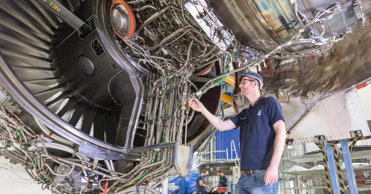 A Rolls-Royce engineer inspects the Trent engine the company plans to use for pure SAF tests. (Photo: Rolls-Royce)