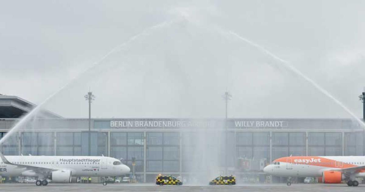 A320neos from Lufthansa and easyJet get water salutes as the first aircraft arrivals at Berlin's new Brandenburg Airport which opened on an overcast Oct. 31, nine years delayed, and billions over budget. (Photo: Flughhafen Berlin Brandenburg GmbH)