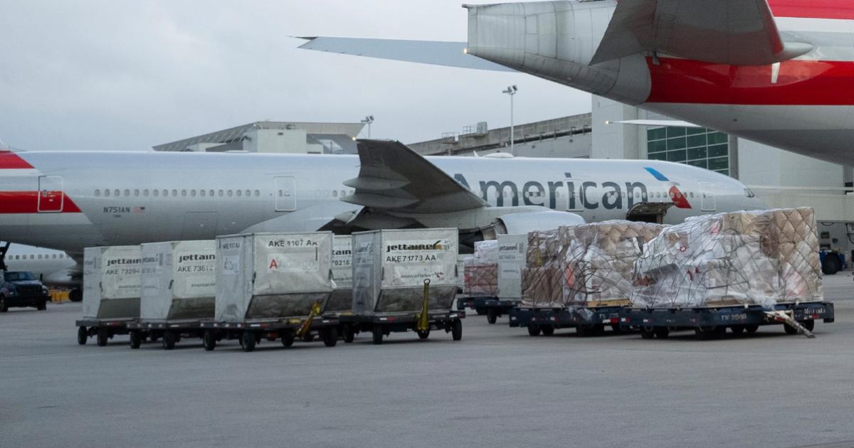A Boeing 777-200 stands ready to accept cargo at Miami International Airport. American’s cargo operation has recently used a 777-200 for trial flights from Miami to South America in preparation for transporting the Covid-19 vaccine. (Photo: American Airlines)