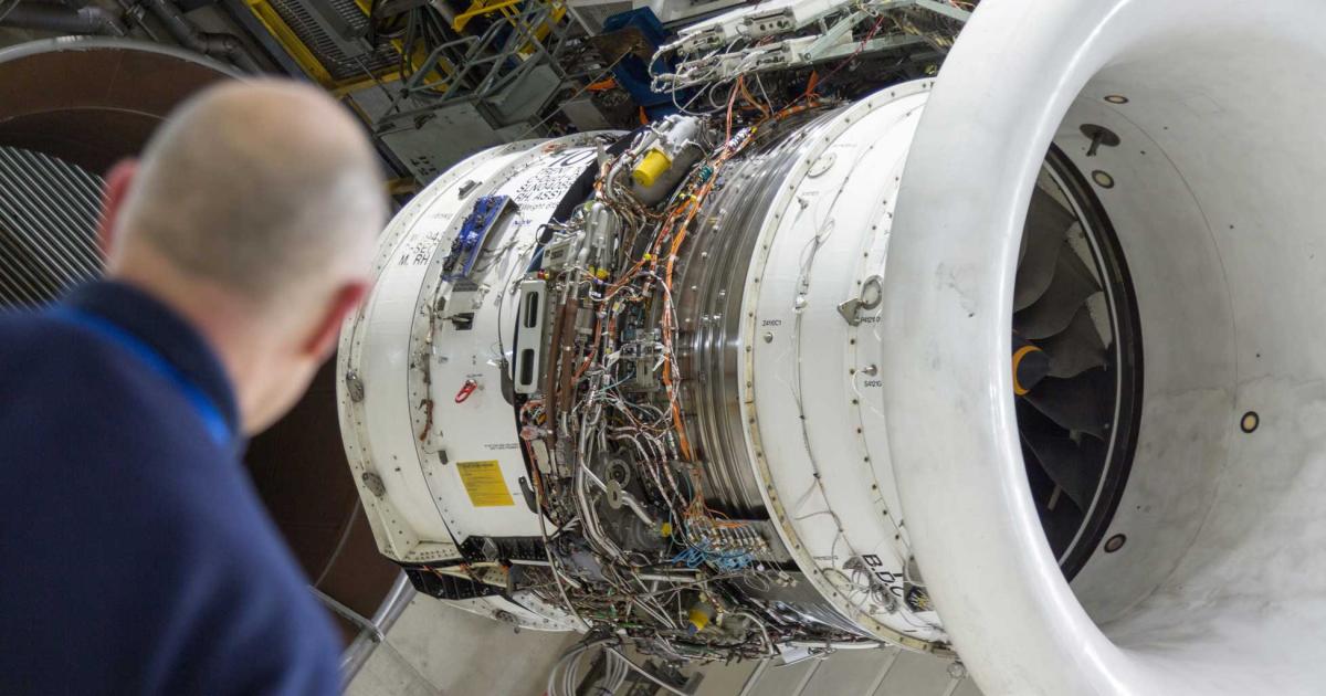Engineers prepare a Rolls-Royce Trent test engine for operational evaluation on 100 percent SAF today at the company's facility in Derby, UK. The test program will also involve one of the manufacturer's Pearl business jet engines, and test flights. (Photo: Rolls-Royce)