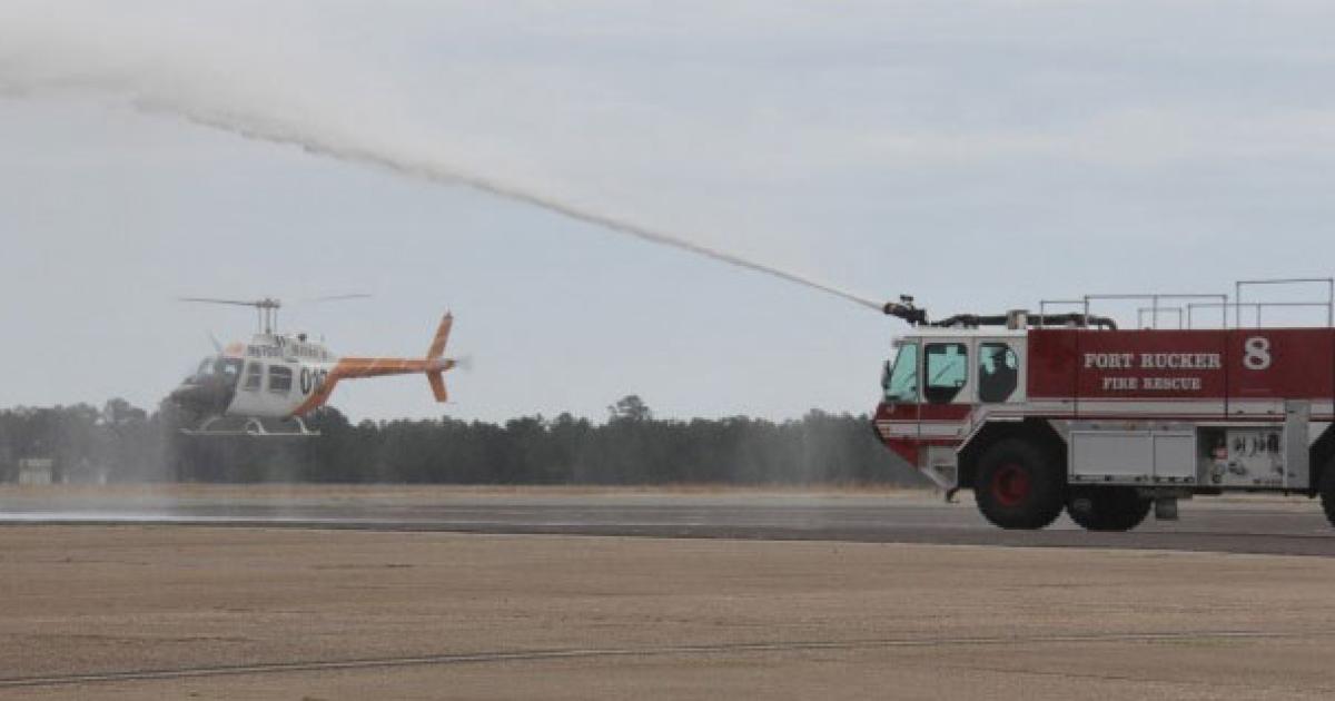 The U.S. Army's last operational Bell TH-67 Creek training helicopters receives a water cannon salute during the type's retirement ceremony earlier this week at Fort Rucker in Alabama. It had served as the service's primary rotorcraft trainer for nearly three decades before being supplanted by the UH-72A Lakota. 