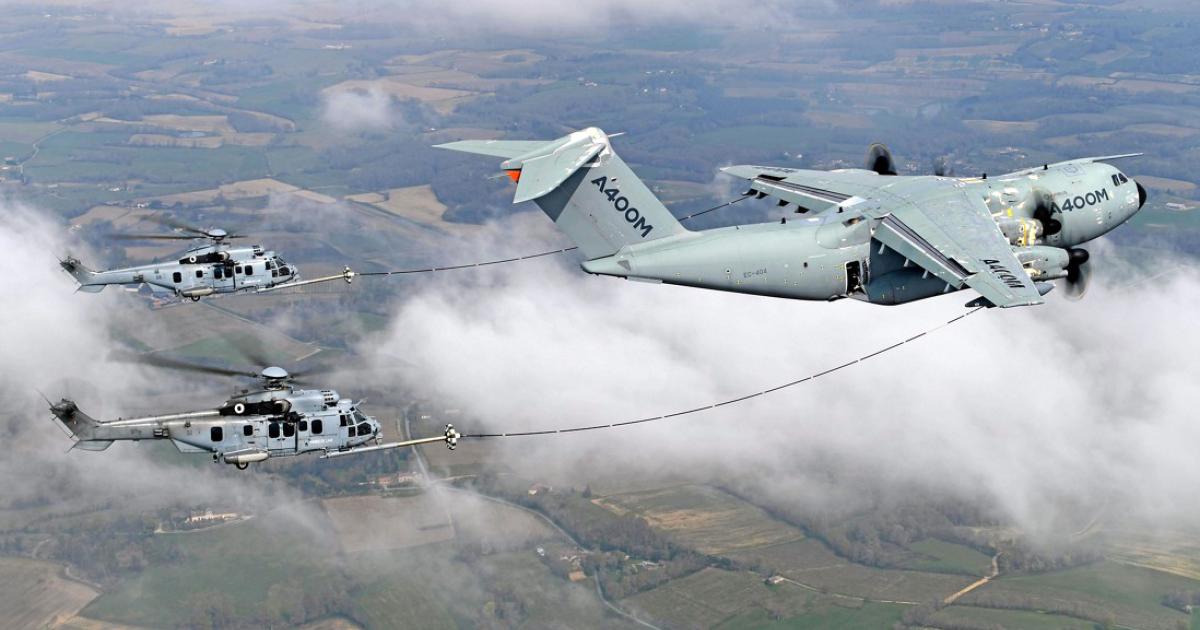 An Airbus A400M development aircraft conducts refuelling trials with a pair of French H225M Caracals. (Photo: Airbus)