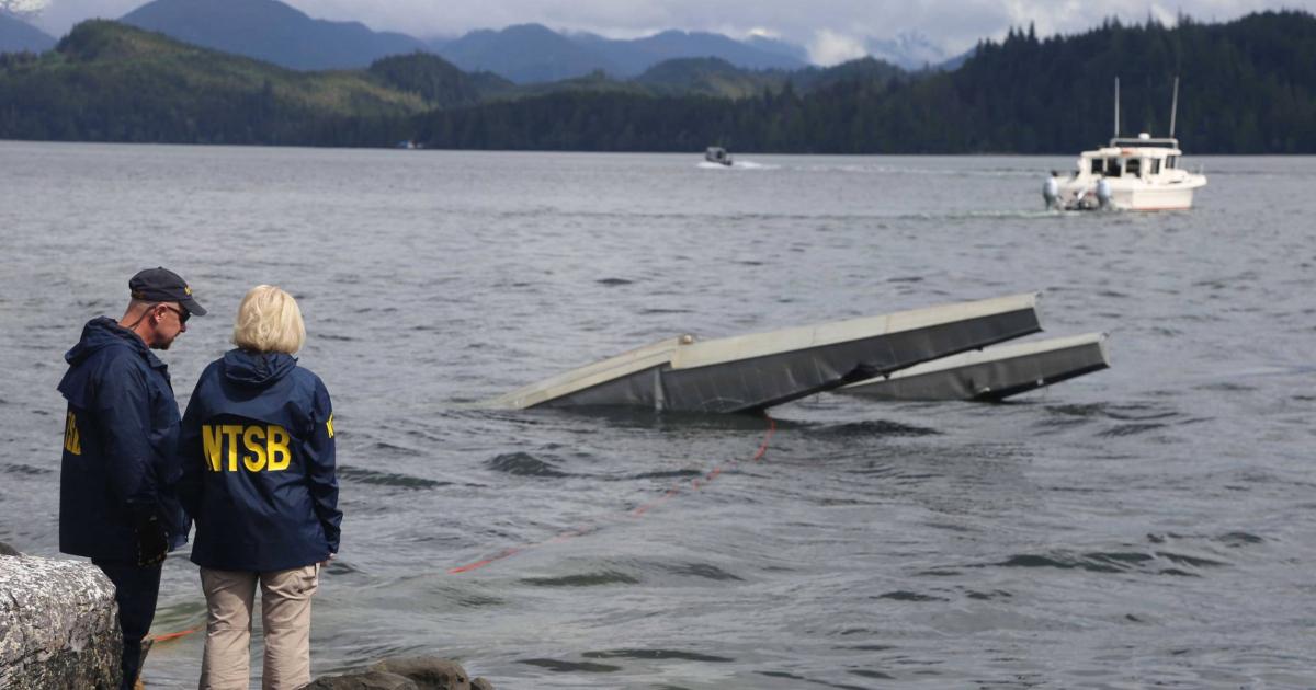 NTSB investigator Clint Crookshanks and board member Jennifer Homendy near the site of some of the wreckage of the DHC-2 Beaver that was involved in the midair collision near Ketchikan, Alaska, on May 13, 2019. (NTSB Photo by Peter Knudson)