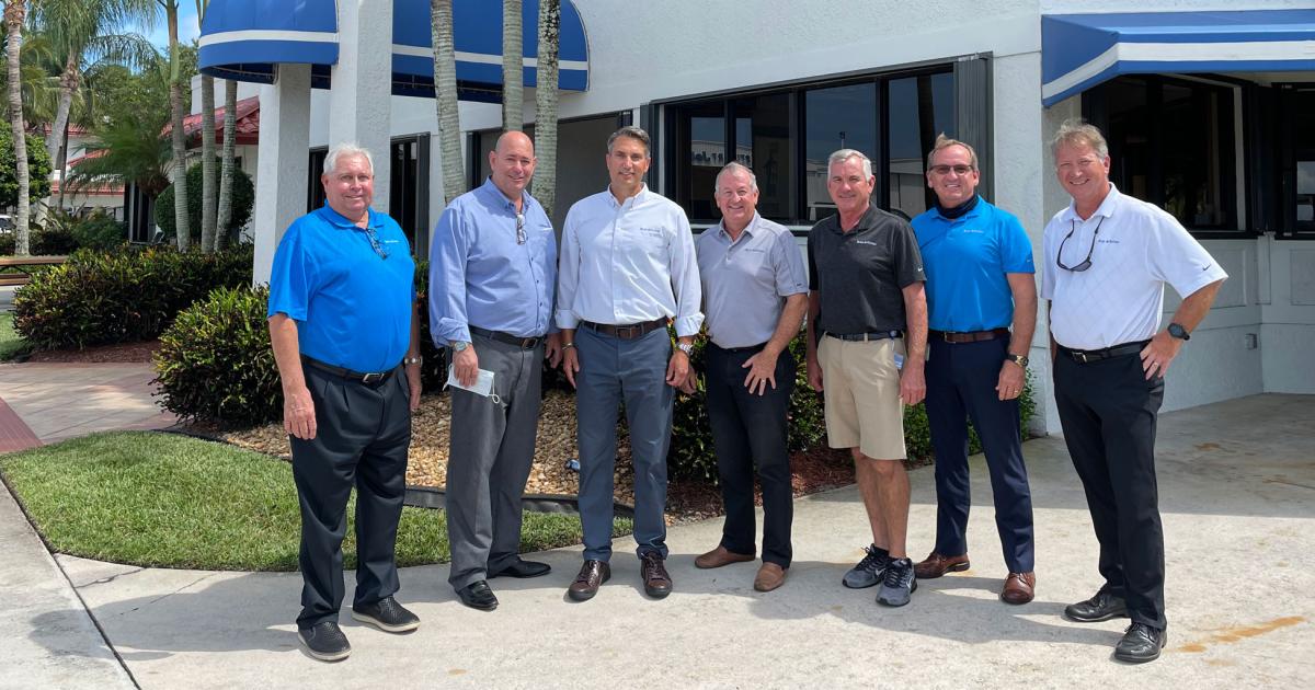 Celebrating the transition of the Stuart Jet Center into the Ross Aviation network are (l-r): Ross Aviation COO Cy Farmer, CFO Lance Allen, CEO Brian Corbett, Dan Capen, v-p and general manager of Ross Aviation at Stuart Jet Center, line service manager Doug Capen, customer service manager Jeff Capen, and Ross Aviation v-p of operations Larry Jorash. The move gives the Ross chain its second FBO in Florida and its 19th overall.
