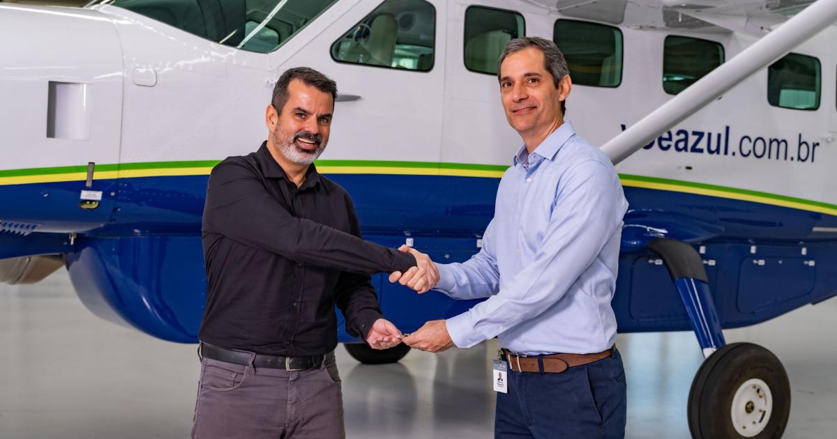 Azul Conecta chief pilot Carlos Guedes (l) and Marcos Nogueira, Textron Aviation regional sales director (r), celebrate the delivery of two Grand Caravan EX turboprop singles under an order the regional carrier recently place for up to 10 of the model. (Photo: Textron Aviation)