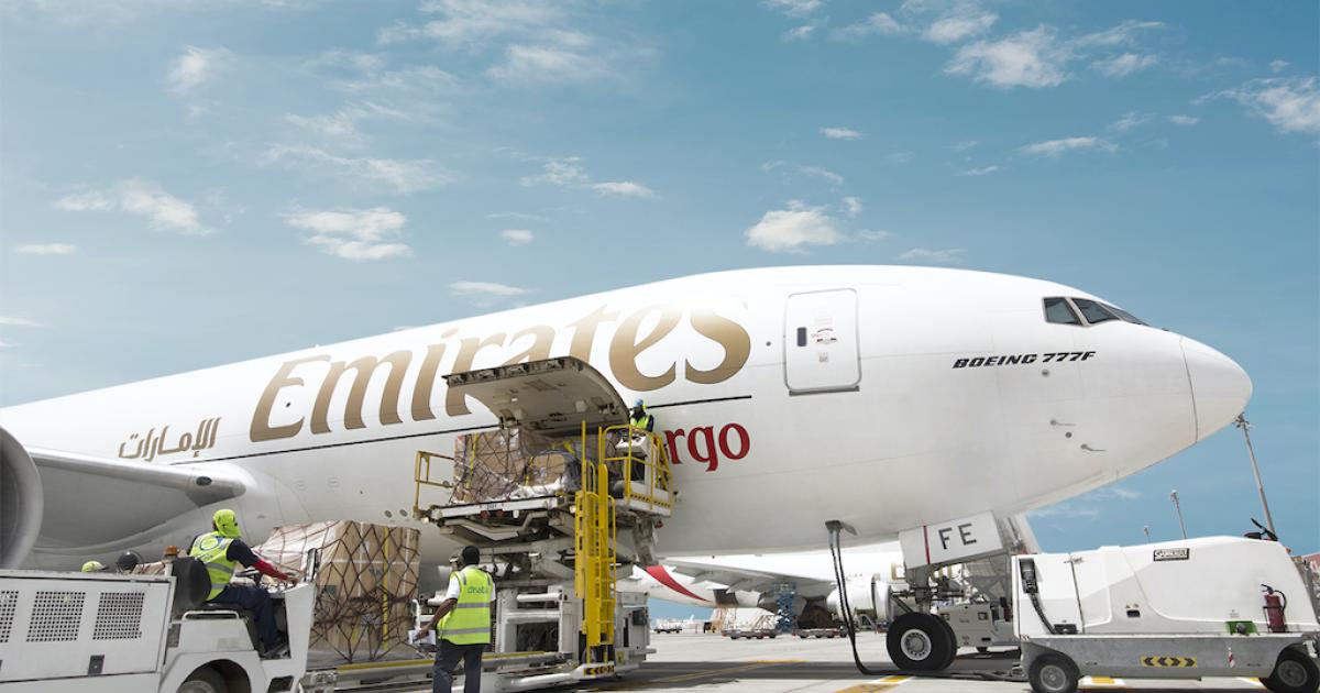 Ground crews load an Emirates Boeing 777F at Dubai South. (Photo: Emirates)