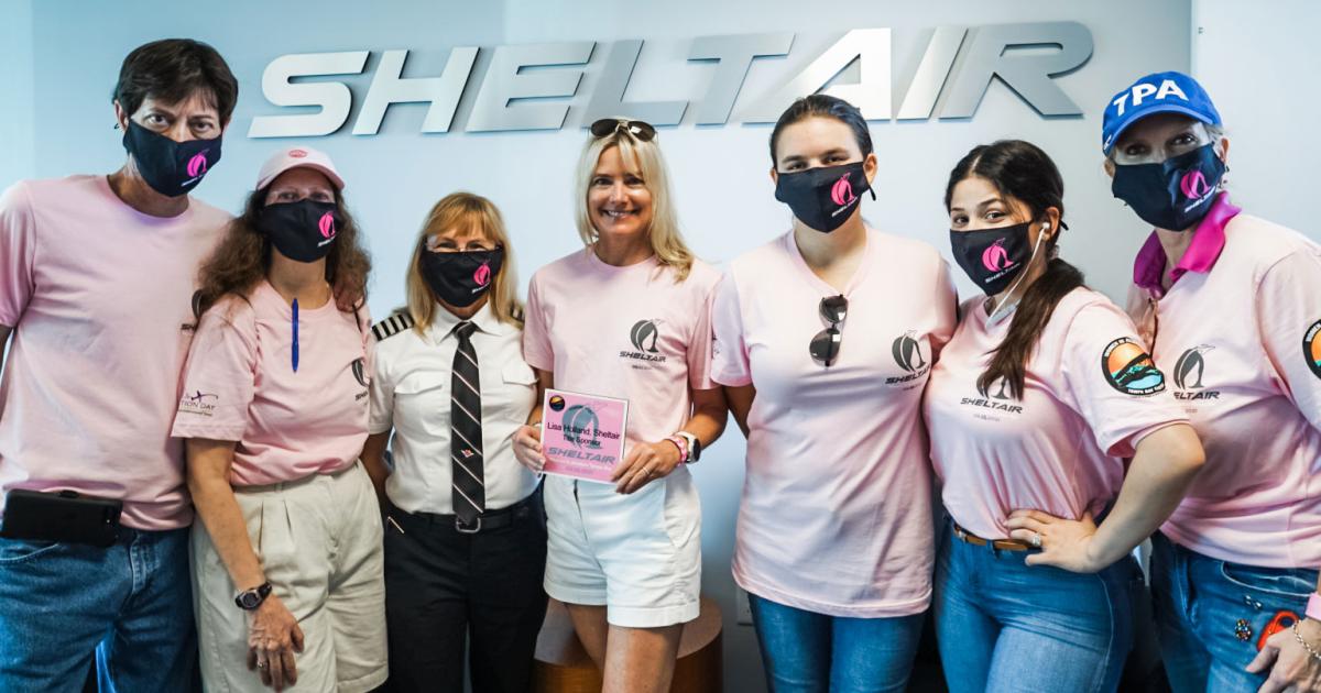 Sheltair president Lisa Holland (center) and several dozen volunteers showed off the career possibilities in aviation to a group of girls at the company's Tampa International Airport location last Saturday. (Image: Sheltair)