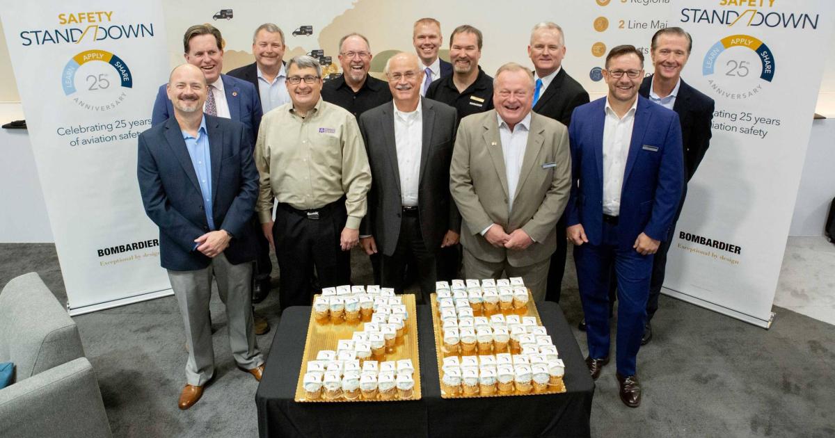 Members of Bombardier and the Safety Standdown Advisory Committee celebrate the 25th anniversary of the safety seminar.