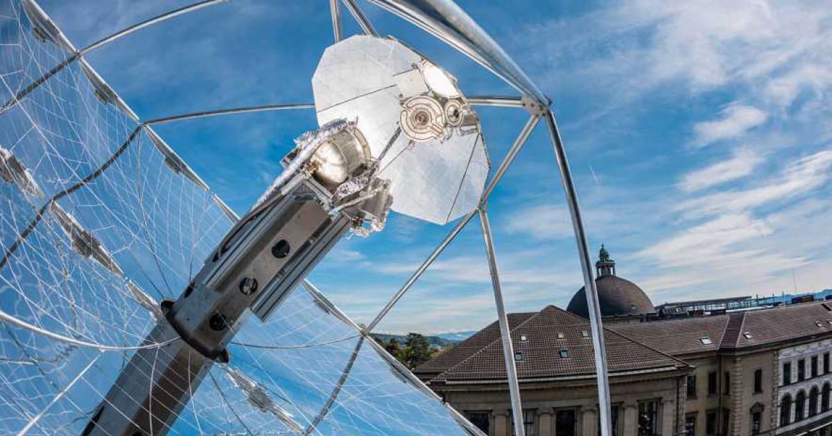 This solar reactor demonstrator on the roof of the machine laboratory at ETH Zurich, uses a sun-​tracking, parabolic reflector to concentrate the sunlight that powers the reaction which eventually turns atmospheric carbon dioxide and water into drop-in hydrocarbon fuels. According to the researchers, the reaction can be tailored to produce specific fuels. (Photo: Alessandro Della Bella/ETH Zurich)
