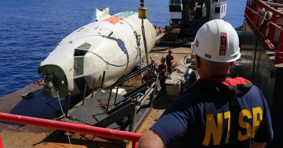 Salvage experts recover the forward section of the fuselage of a Transair Boeing 737 from the Pacific Ocean about two miles from Ewa Beach near Honolulu, on October 21. (Photo: NTSB)