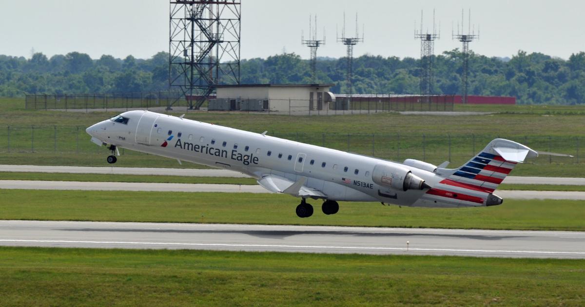 A PSA Airlines CRJ700 takes off from Cincinnati-Northern Kentucky International Airport. American Airlines has placed much of the burden for schedule adjustments on its American Eagle regional affiliates. (Photo: Flickr: <a href="http://creativecommons.org/licenses/by-sa/2.0/" target="_blank">Creative Commons (BY-SA)</a> by <a href="http://flickr.com/people/airlines470" target="_blank">airlines470</a>)