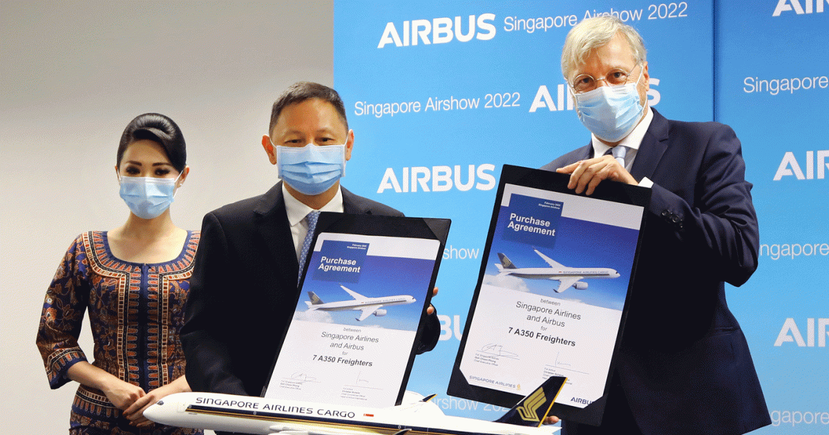 Singapore Airlines CEO Goh Choon Phong (left) is expanding his airline’s commitment to cargo, signing an order for seven A350Fs with Airbus CCO Christian Scherer.