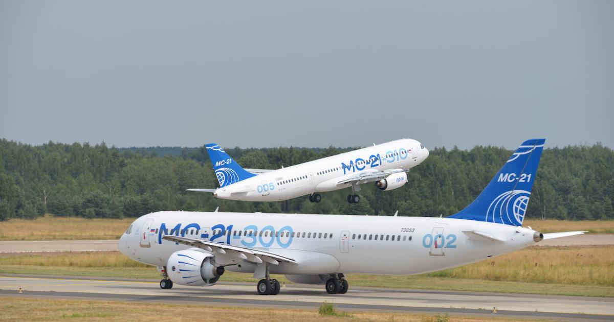 The first MC-21-310 (background) and the second MC-21-300 test example participate in the flying display at last year's MAKS airshow outside Moscow. (Photo: Vladimir Karnozov)