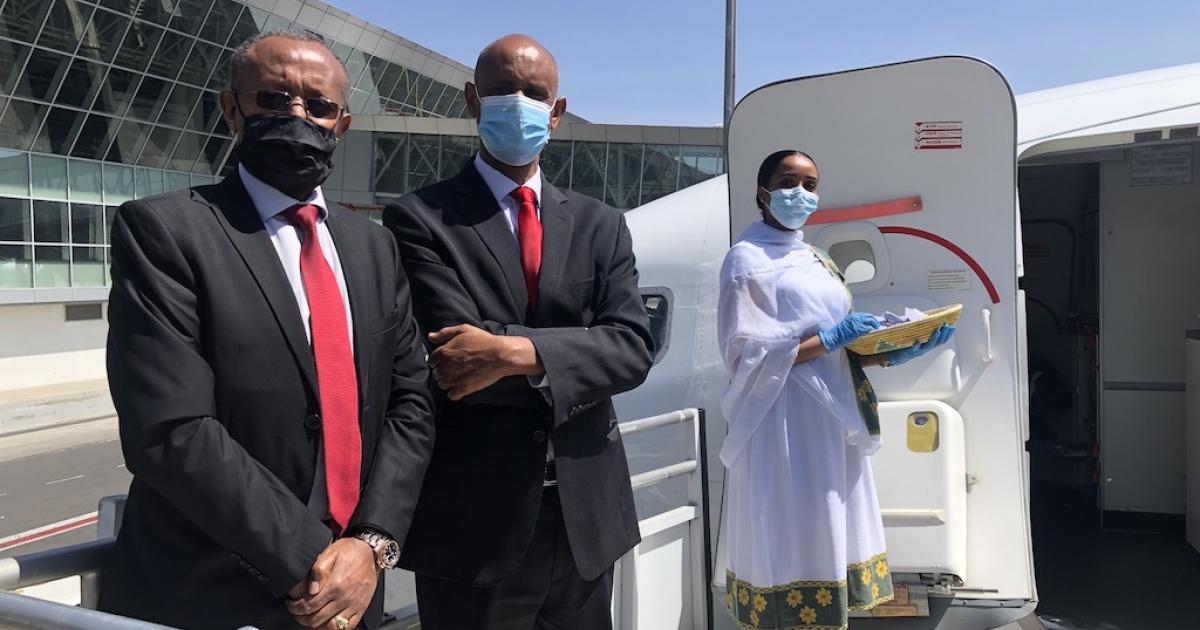 Ethiopian Airlines Group acting CEO Esayas Woldemariam (left) and airline v-p of flight operations Yohannes Hailemariam (center) prepare to greet passengers invited to fly aboard a 737 Max demonstration flight on February 1. (Photo: Kaleyesus Bekele)
